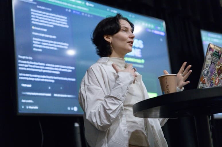 Viivi Marttinen speaking on stage